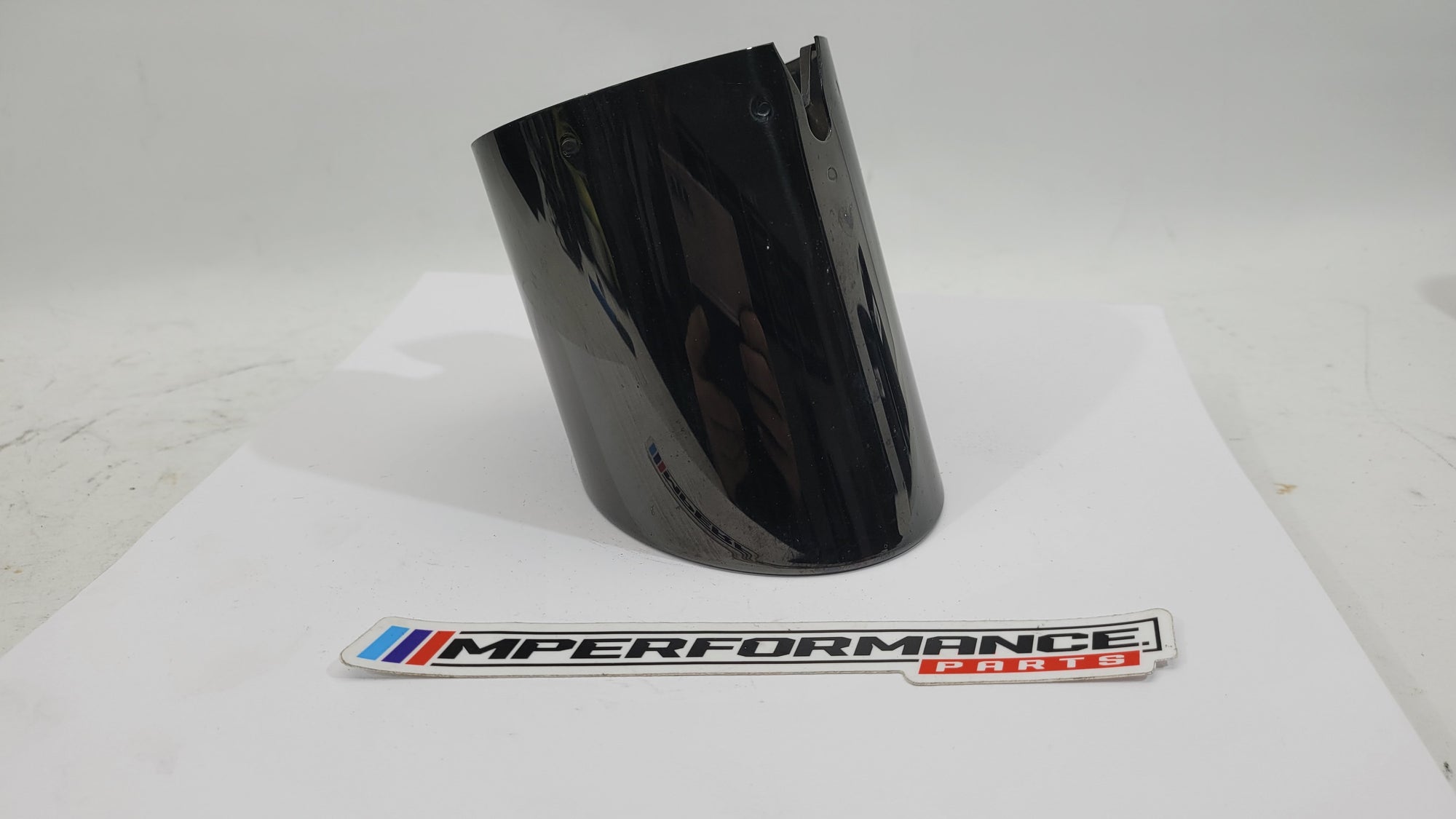 BMW G87 G80 G81 G82 G83 G90 G99 exhaust muffler tailpipe in black chrome, MPerformance.parts, showing sleek, polished finish.