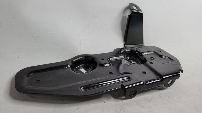 BMW 328I F30 underbody fuel tank guard plate and fuel line bracket, black metal mount for engine protection and fuel line support.