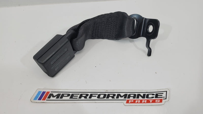 BMW M3 G80 rear centre middle seat belt buckle, genuine MPerformance.parts, close-up of black buckle with metal latch.