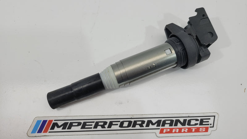 BMW F3x F8x petrol ignition coil by MPerformance.parts, showing a close-up of the black coil with electrical connectors.