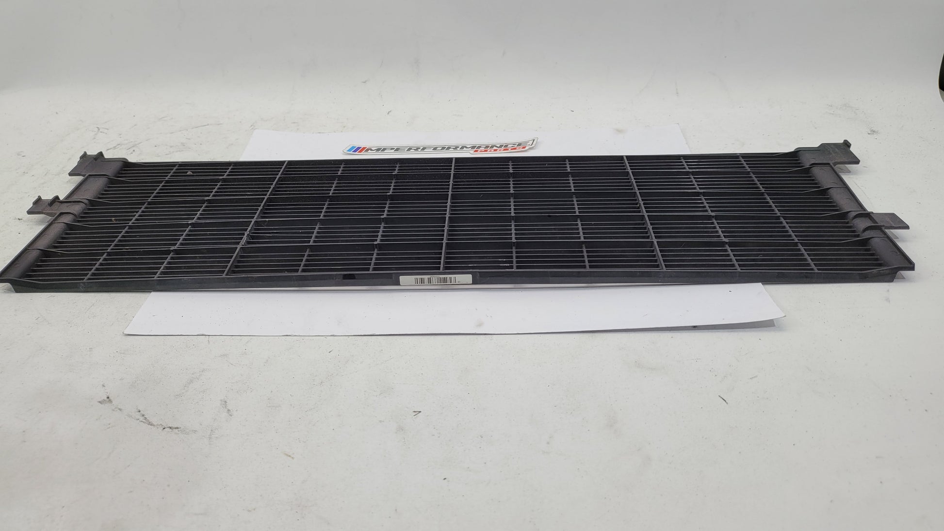 BMW G80 G82 G83 M3 M4 Competition plastic radiator cover shroud by MPerformance.parts, shows the sleek black engine bay component.