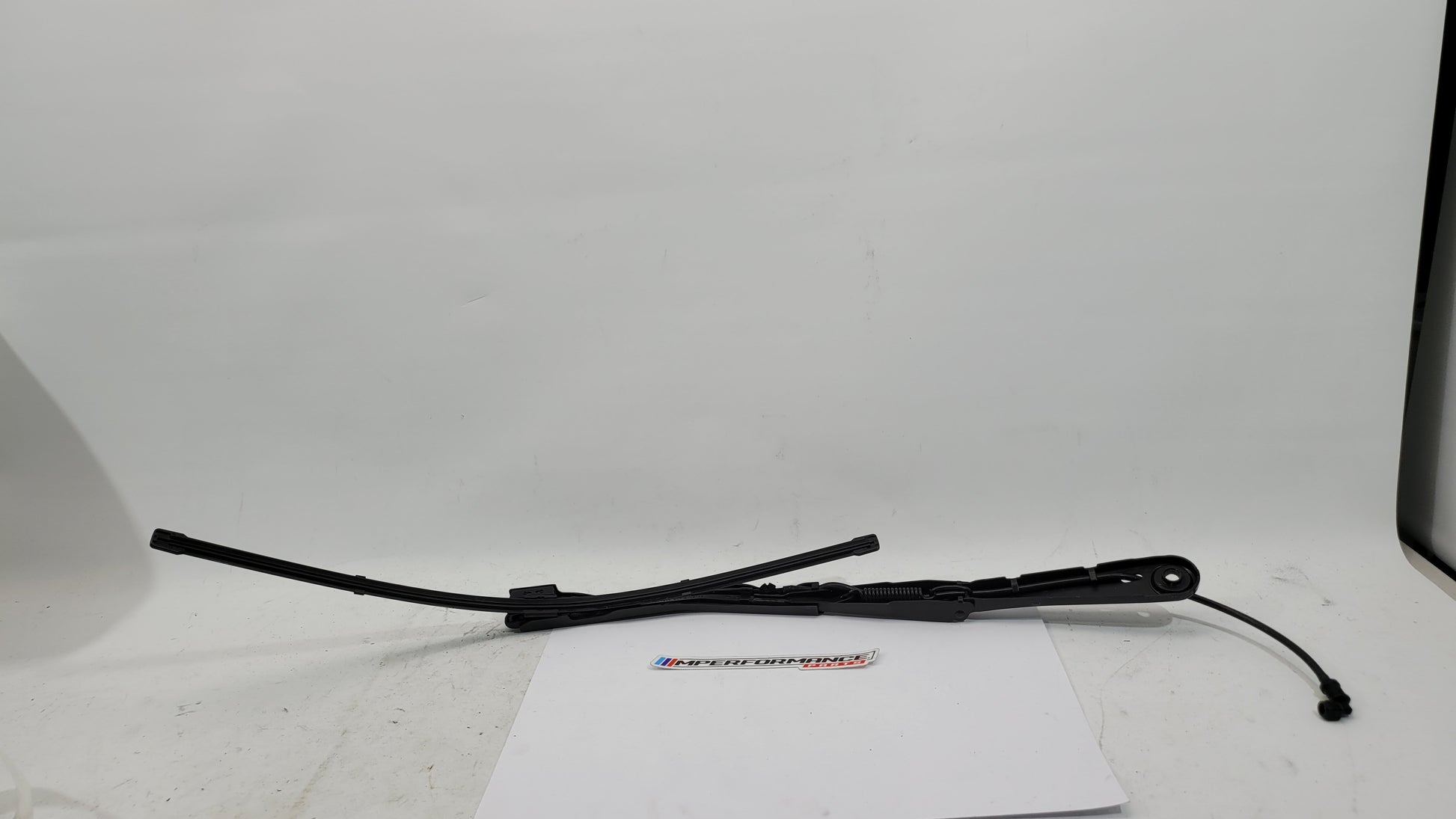 BMW M3 G8x driver side front wiper arm by MPerformance.parts, showing the sleek metal wiper arm with mounting connection.