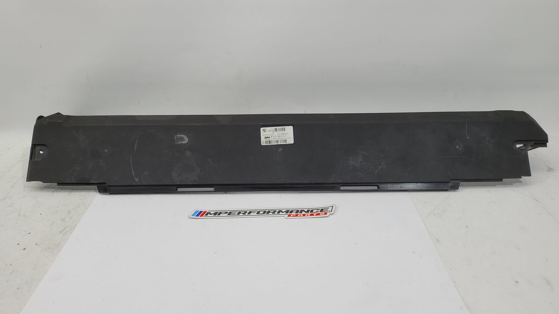 BMW M3/4 G8x cooling radiator upper cover by MPerformance.parts, showcasing the sleek black component with mounting details.