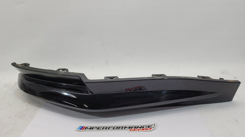 BMW G80 M3 rear right bumper corner spat splitter by MPerformance.parts, showing the aerodynamic side component for the driver side.