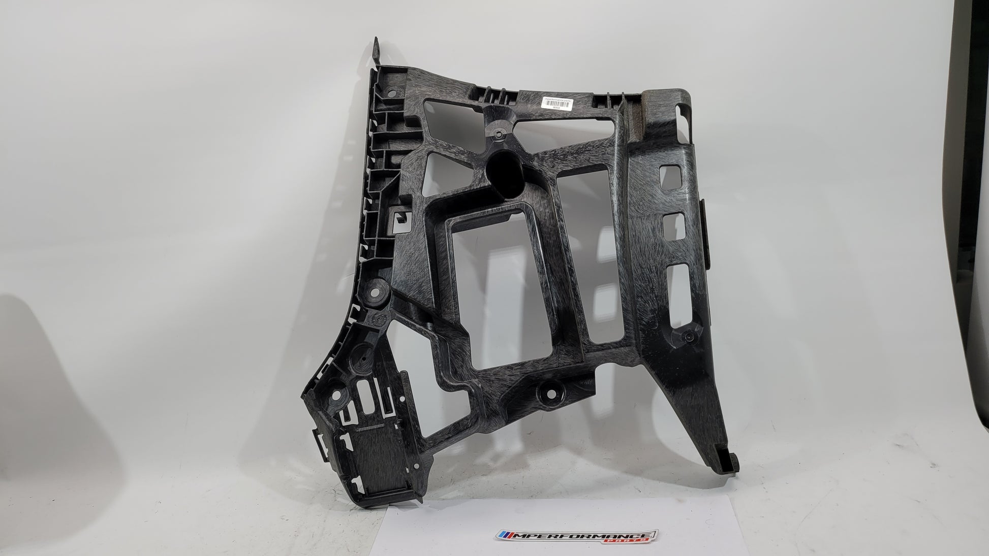 BMW M3 xDrive G80 rear bumper support bracket, part number 8069446, shown mounted on the vehicle's rear underside.