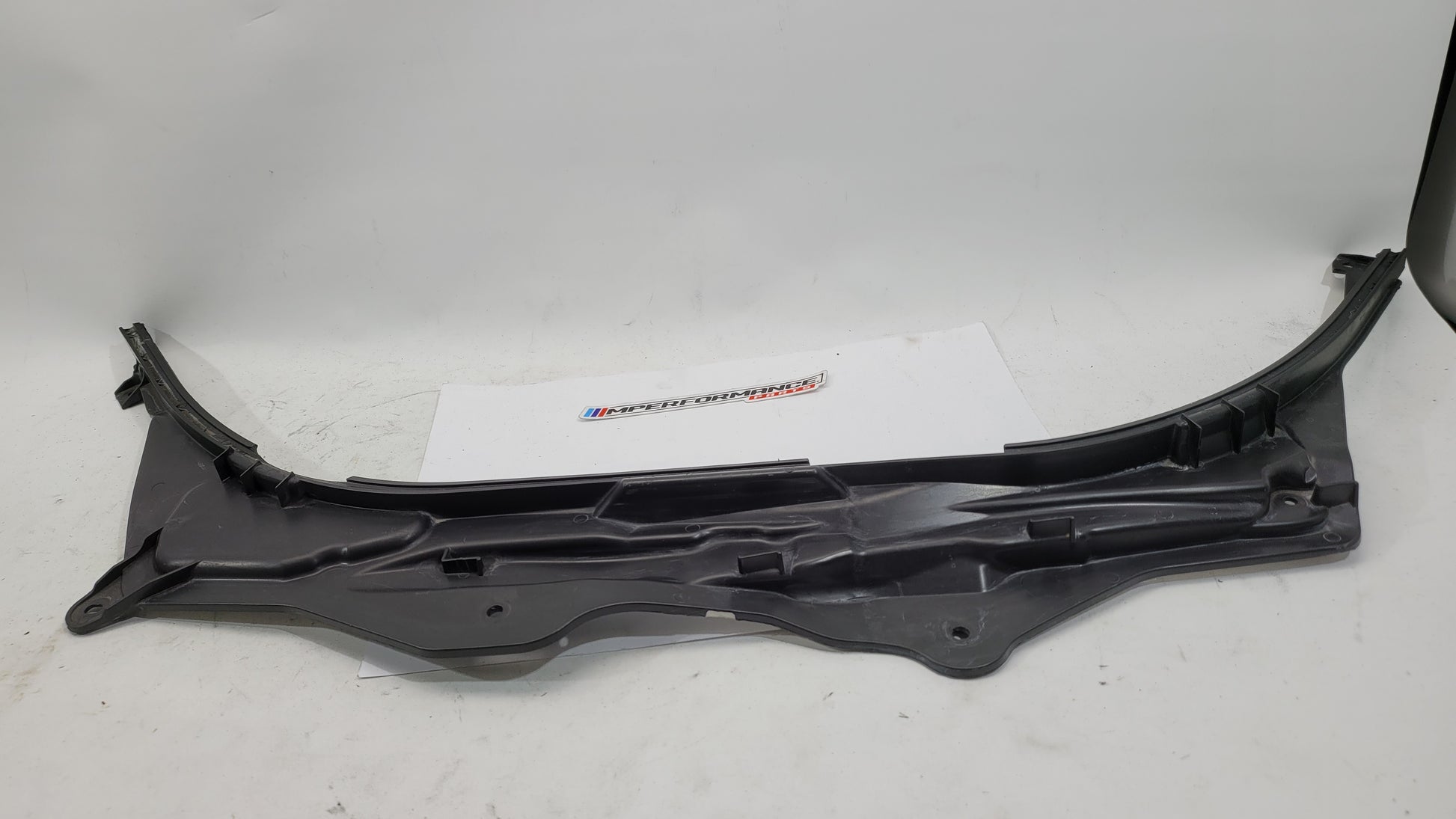 BMW M3 G8X firewall upper section cover panel, black metal with mounting holes, part number 7428168, from MPerformance.parts.