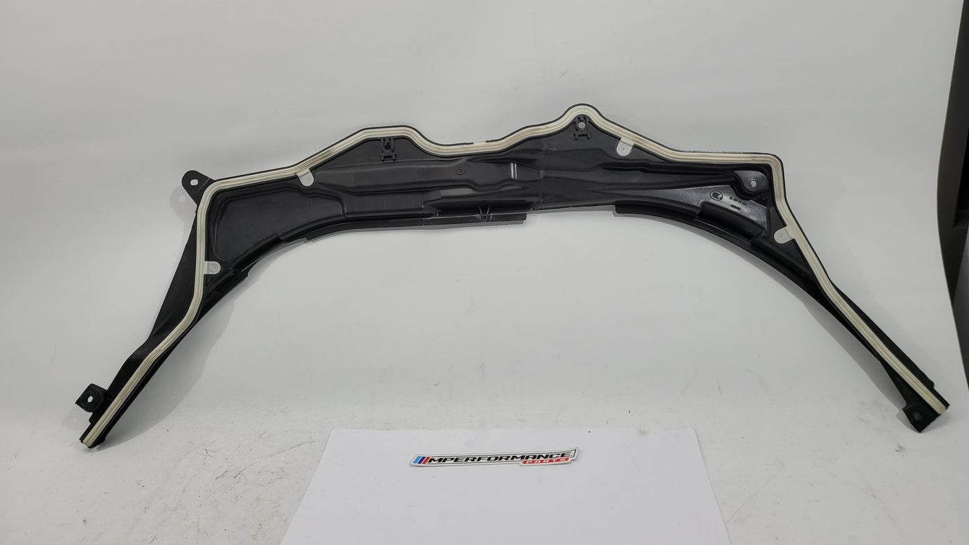 BMW M3 G8X firewall upper section cover panel in black, with mounting points and textured finish, designed for engine bay protection.