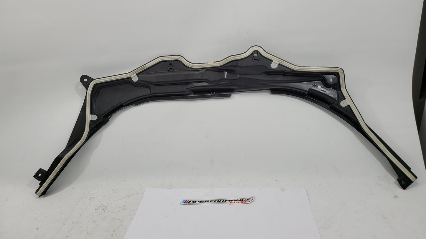 BMW M3 G8X firewall upper section cover panel in black, with mounting points and textured finish, designed for engine bay protection.