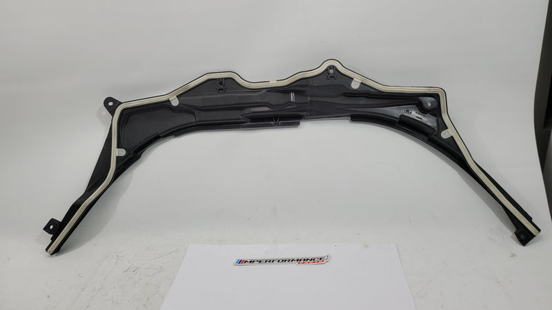 BMW M3 G8X firewall upper section cover panel in black, with mounting points and textured finish, designed for engine bay protection.