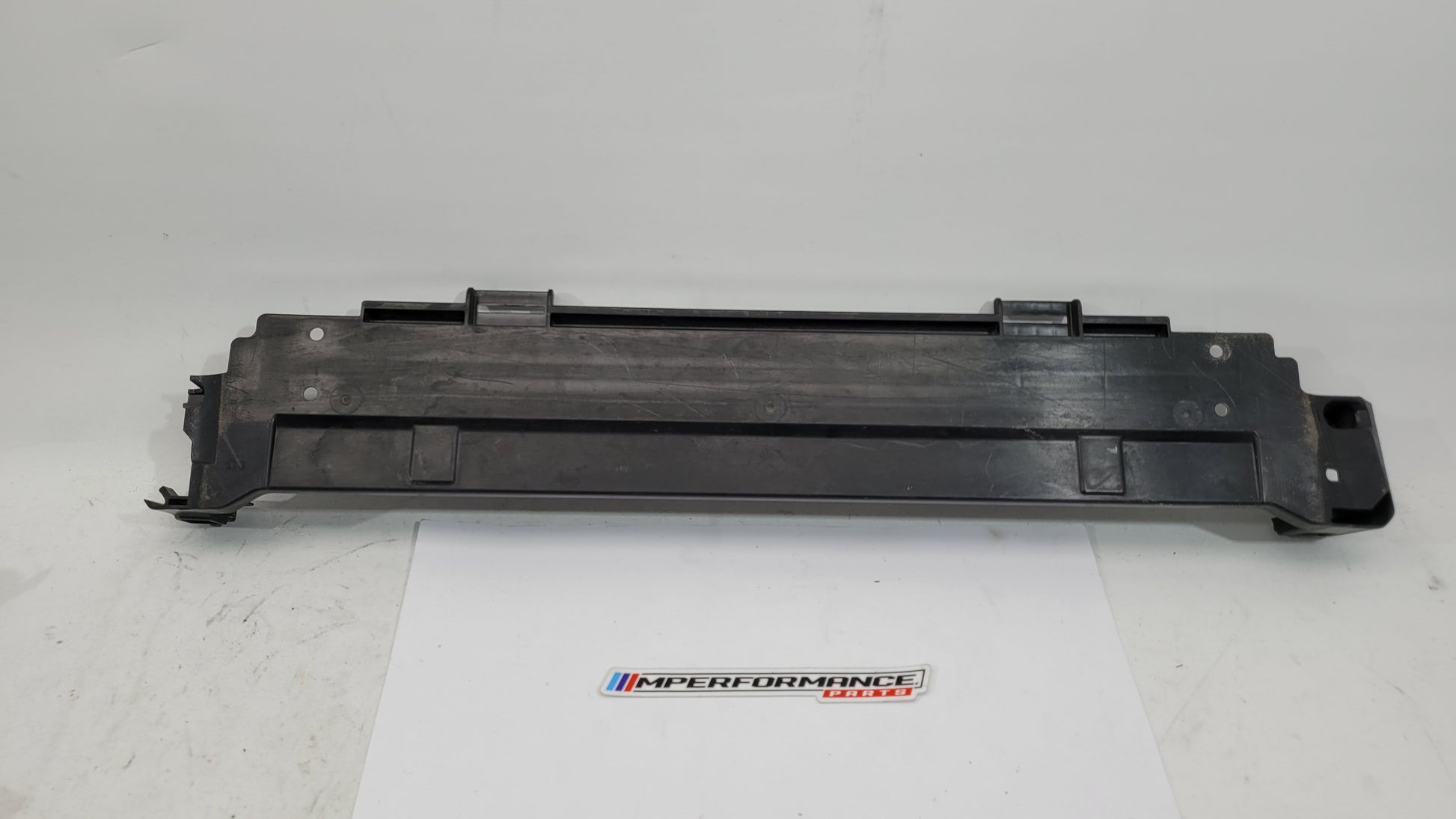BMW M3 M4 G8x 2021-2025 front lower radiator cover from MPerformance.parts, showing the black plastic grille and mounting points.