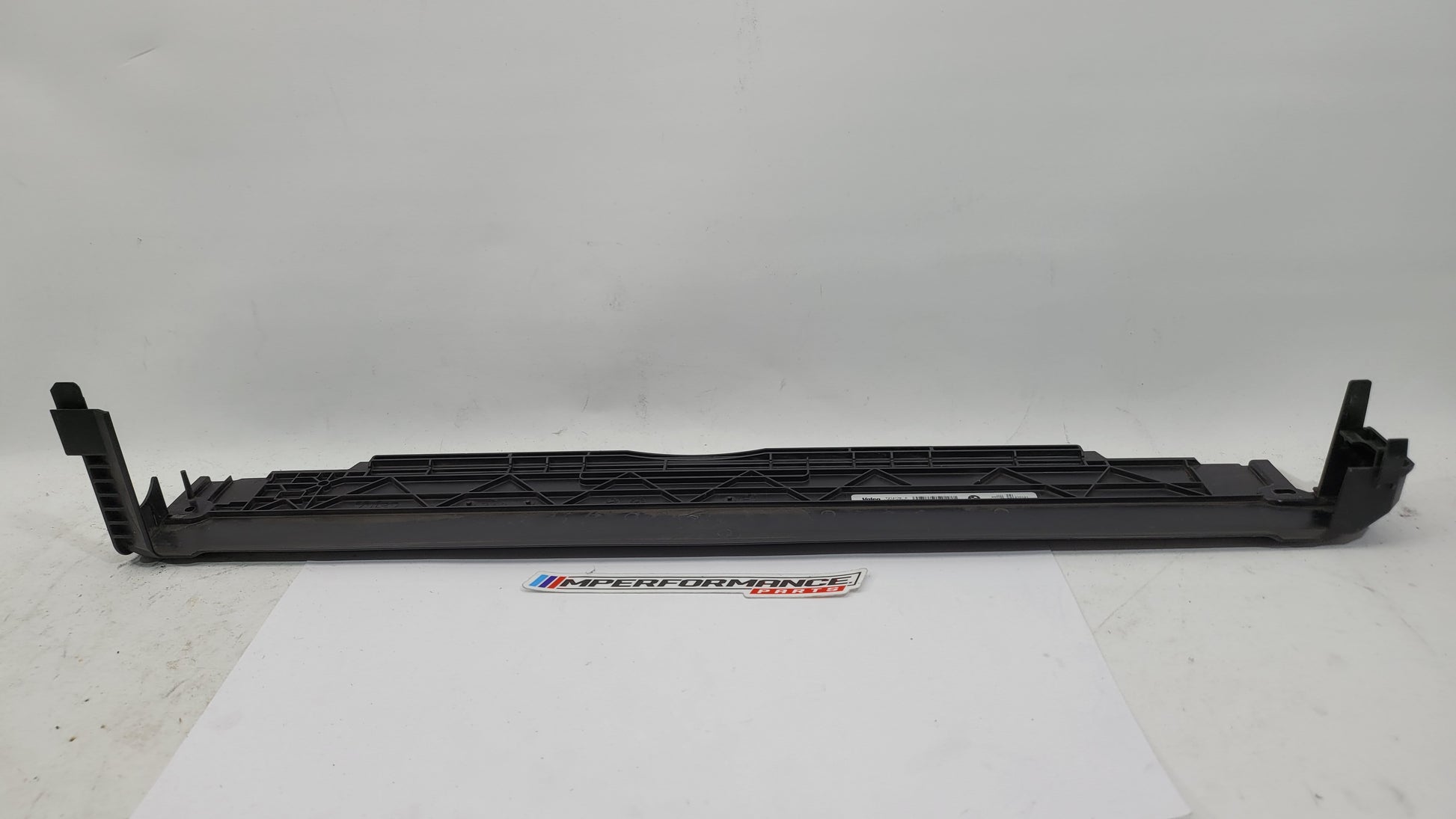 BMW M3 M4 G8x cooling radiator upper cover by MPerformance.parts, showing the sleek black component with mounting details.