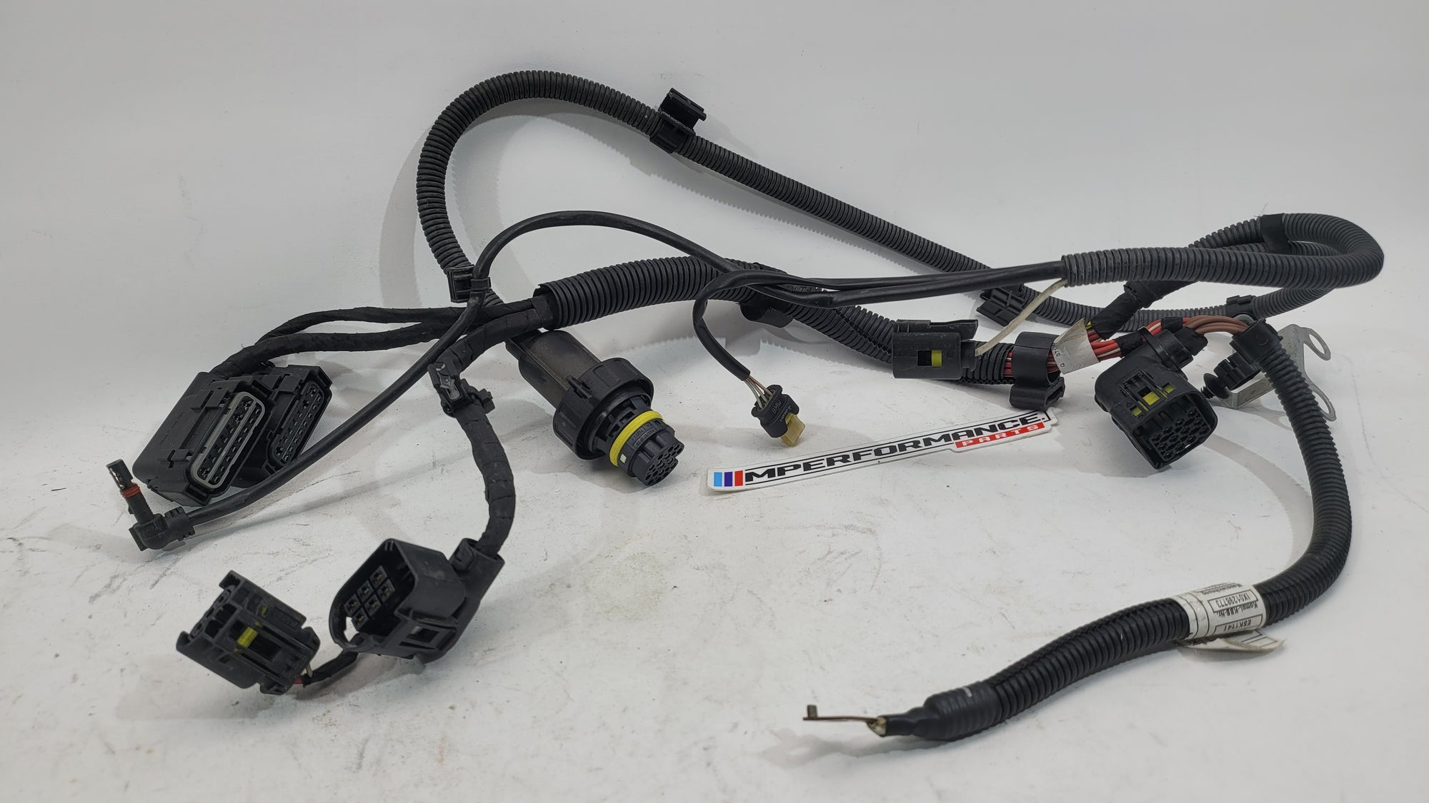 BMW M2 M3 M4 F80 F83 F82 series gearbox wiring loom by MPerformance.parts, showing a detailed view of the electrical harness.