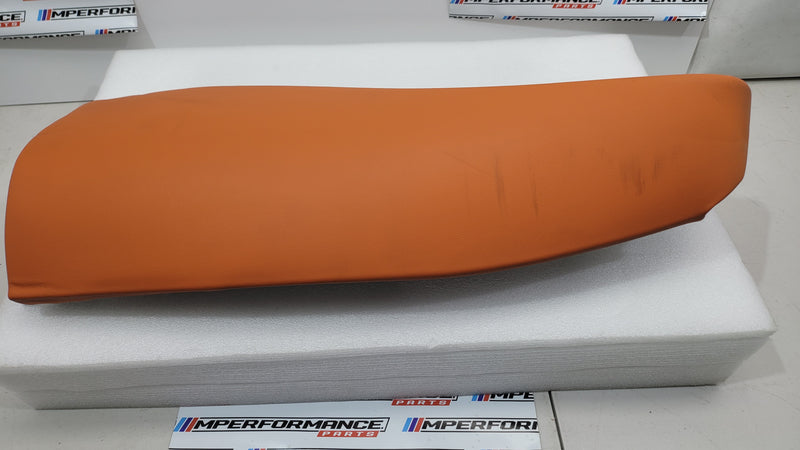 G80 M3 Kyalami Orange left rear seat bolster by MPerformance.parts, showing detailed close-up of the vibrant car upholstery.