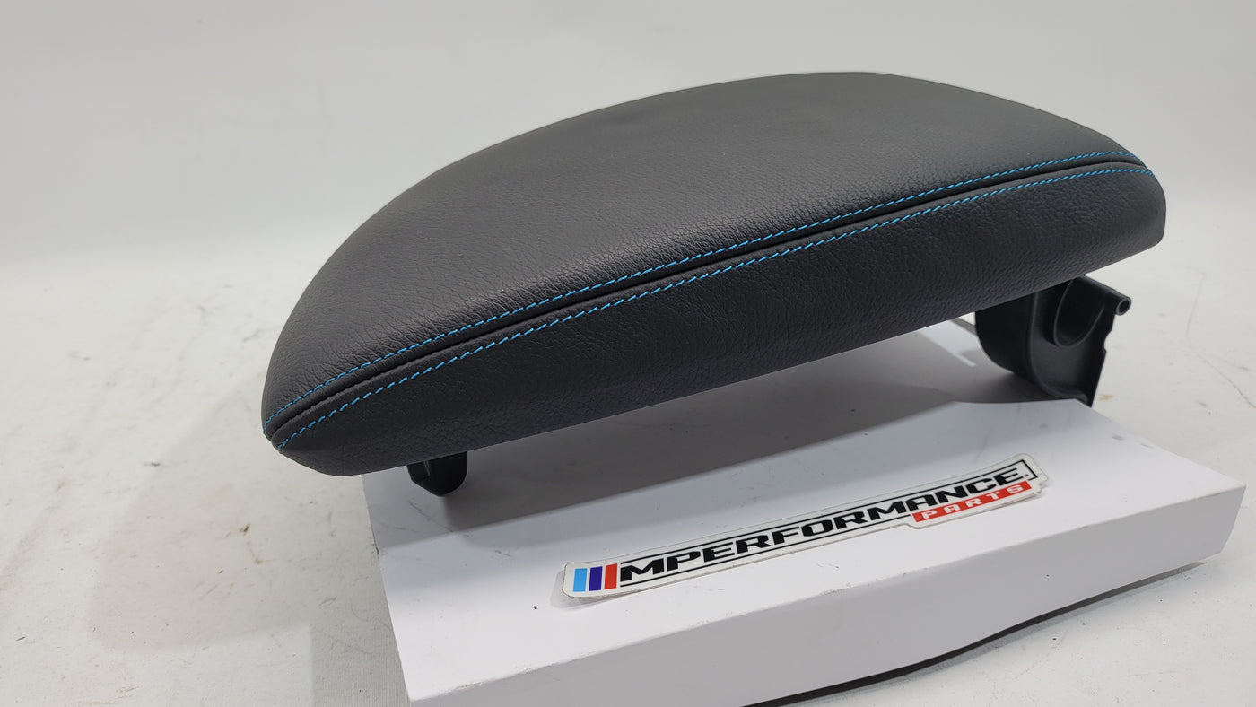 BMW M2 F87 Competition leather armrest with blue stitching, showing the sleek leather surface and detailed stitching design.