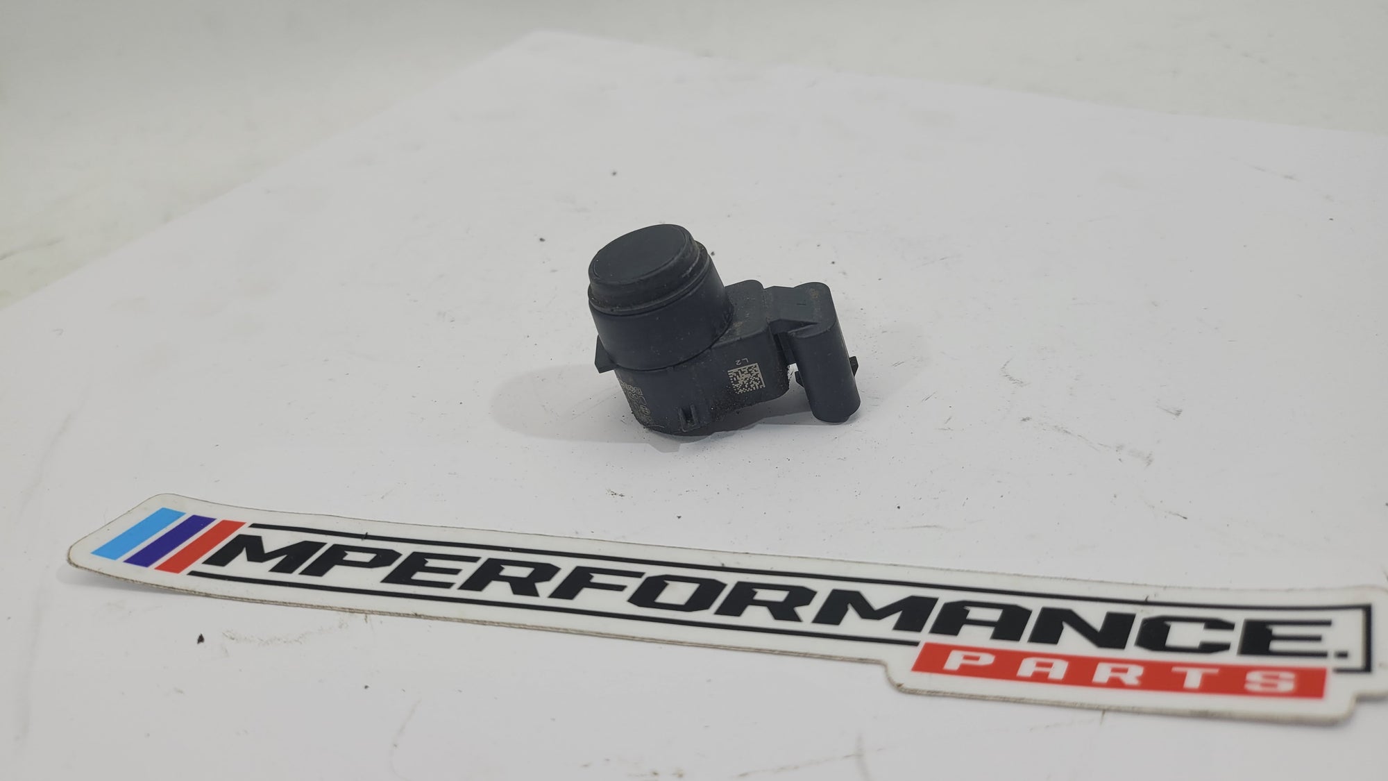 BMW E92 M3 bumper bar parking sensor by MPerformance.parts, close-up of the sensor integrated into the bumper.
