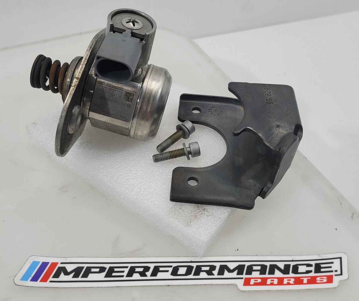 Close-up of MPerformance.parts automotive component with part numbers 07544 and 13517584461, showing detailed metal and plastic features.