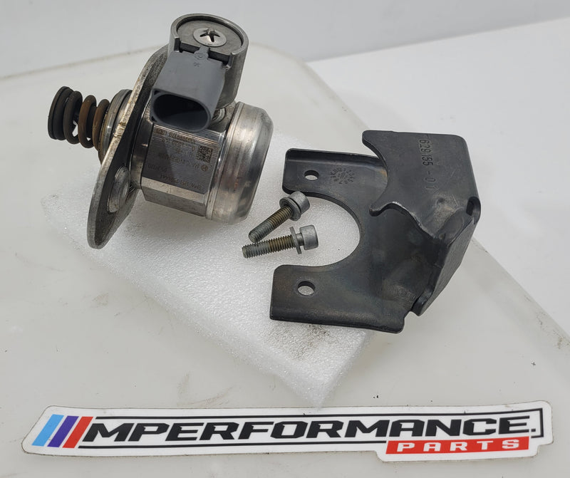 Close-up of MPerformance.parts automotive component with part numbers 07544 and 13517584461, showing detailed metal and plastic features.