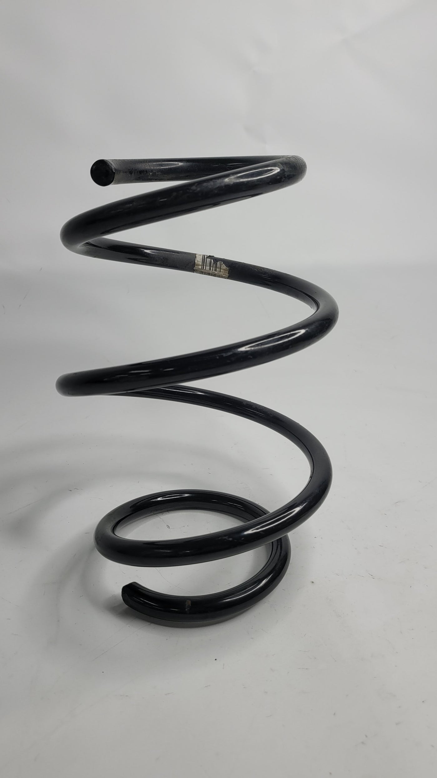BMW F8X M2/3/4 front spring from MPerformance.parts, showing a close-up of the black coil spring with mounting ends.