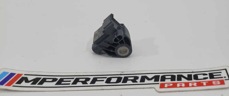 BMW G-Series crash sensor 9496815 by MPerformance.parts, showing a close-up of the black sensor with mounting clips.