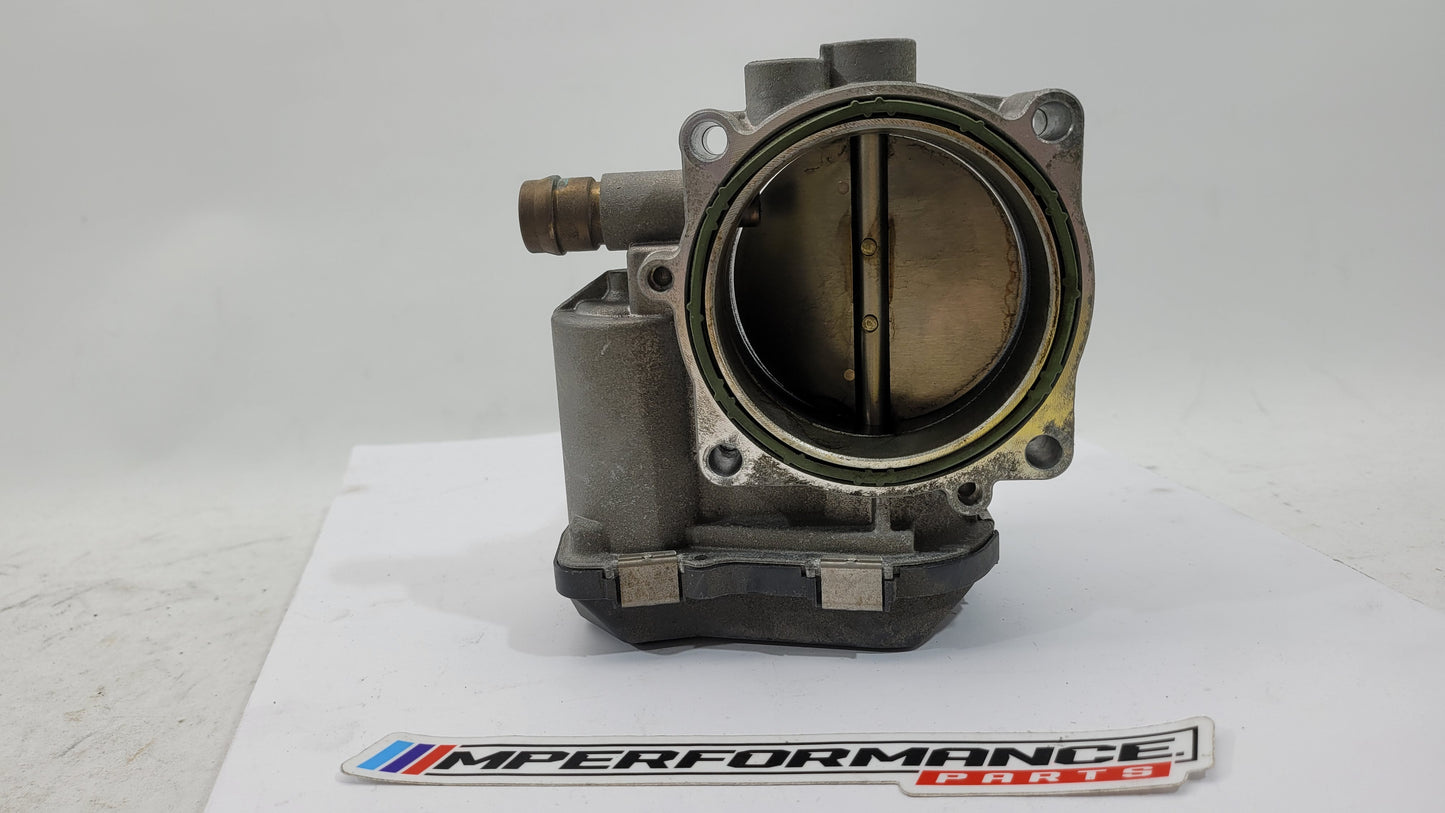 BMW M3 M4 F80 F82 F83 S55 engine throttle body by MPerformance.parts, showing the metallic component with mounting points and connectors.