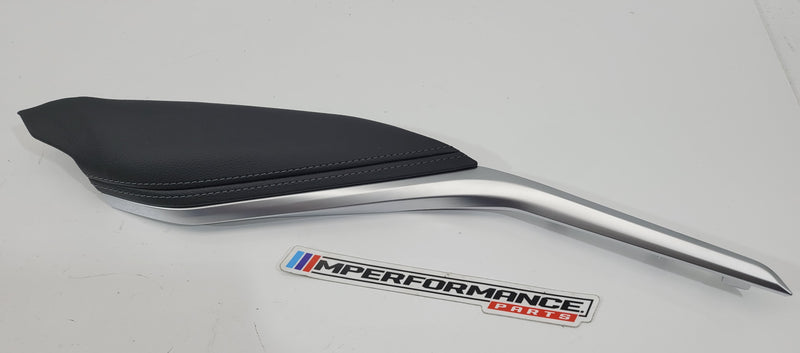 G80 M3 driver knee leather panel by MPerformance.parts, featuring black leather with detailed stitching and mounting points.