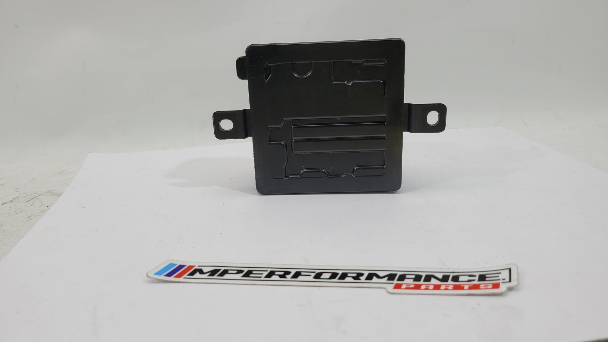 BMW 1/2/3/4 F Series F8x M3 M4 Integrated Supply Module by MPerformance.parts, showing the black automotive module with connectors.