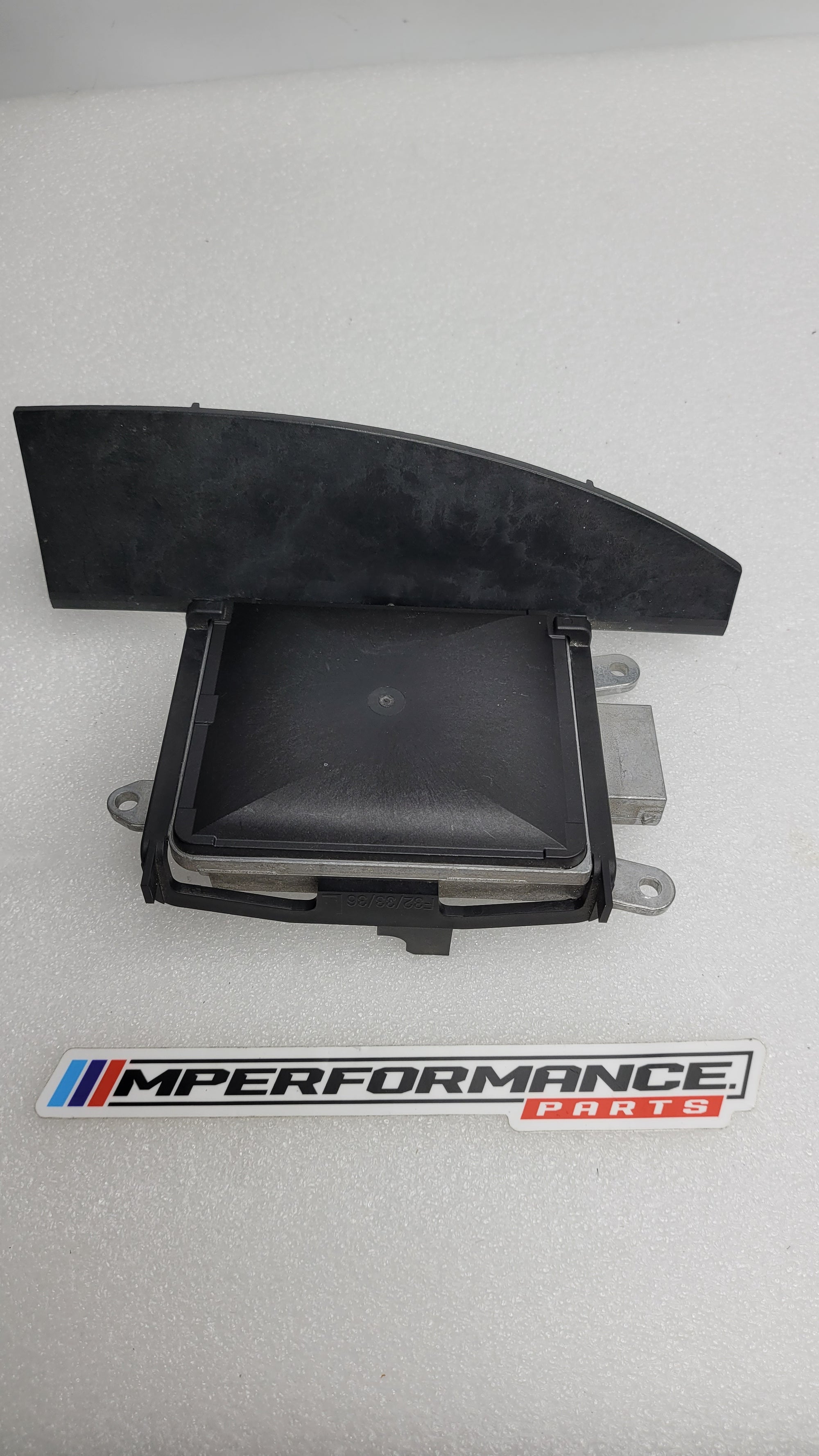 BMW F8x 3/4 Series rear left lane change warning sensor by MPerformance.parts, showing the sensor with mounting details.