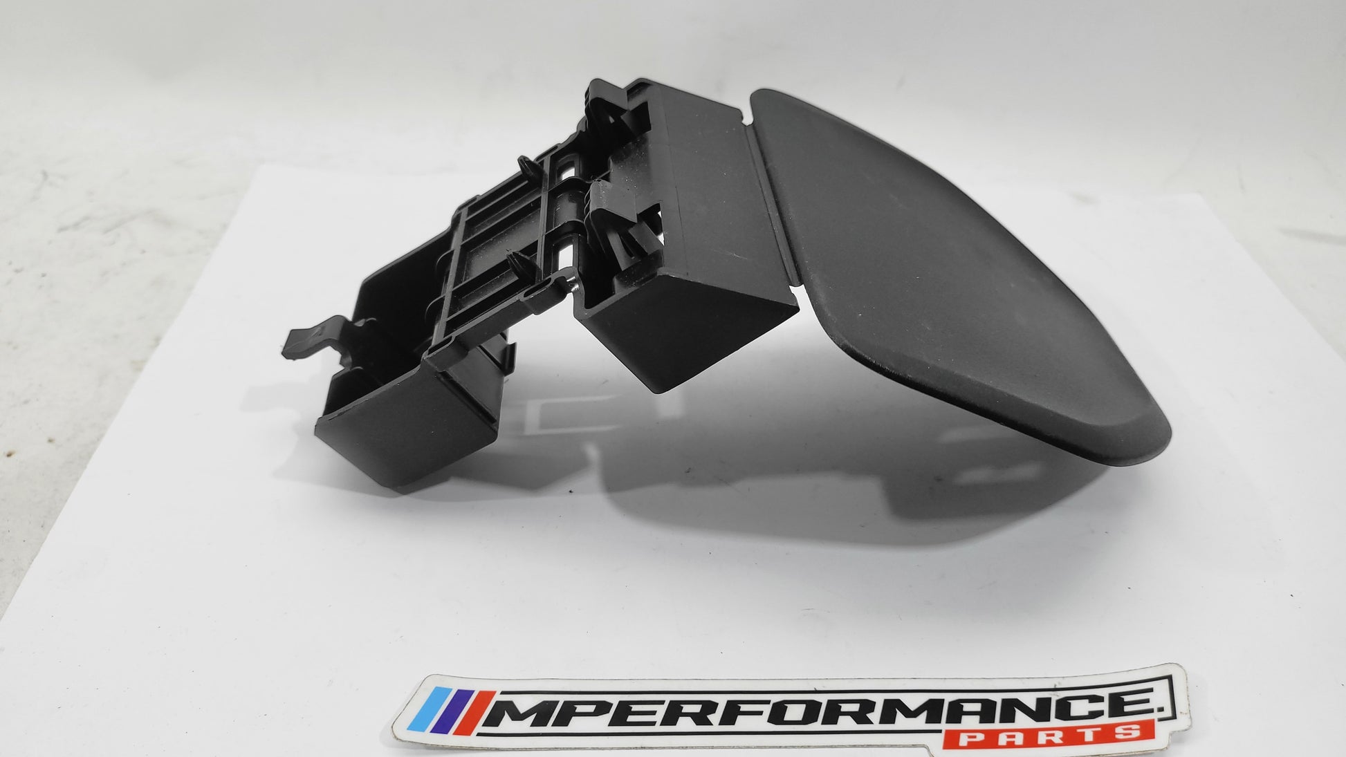 BMW G20 G30 G11 G12 Warning Triangle Carrier Bracket 7383584 by MPerformance.parts, showing the metal mounting bracket for warning triangle.