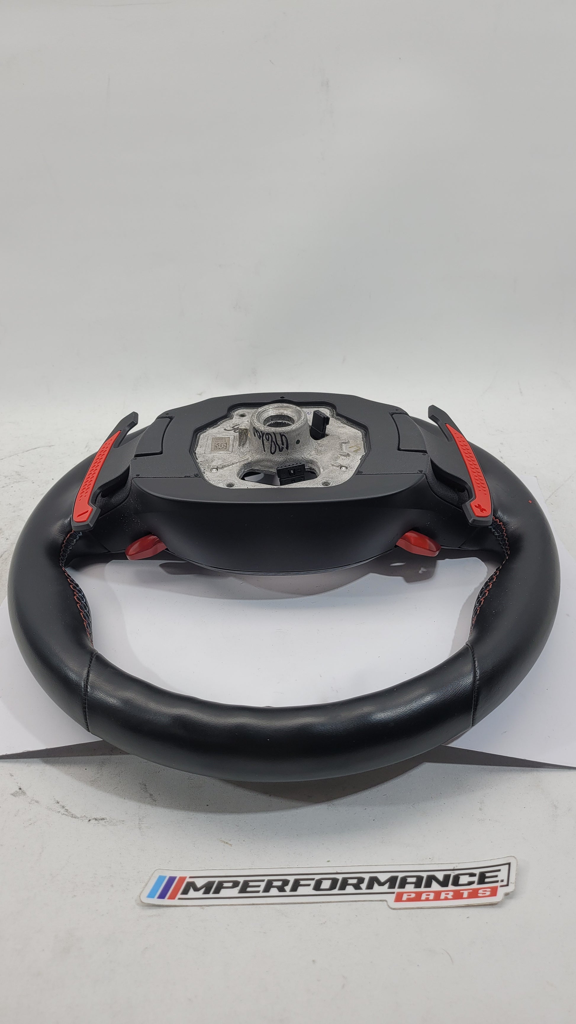 BMW M2 M3 M4 G80 G82 leather M steering wheel with black and silver accents, sporty design, and MPerformance.parts branding