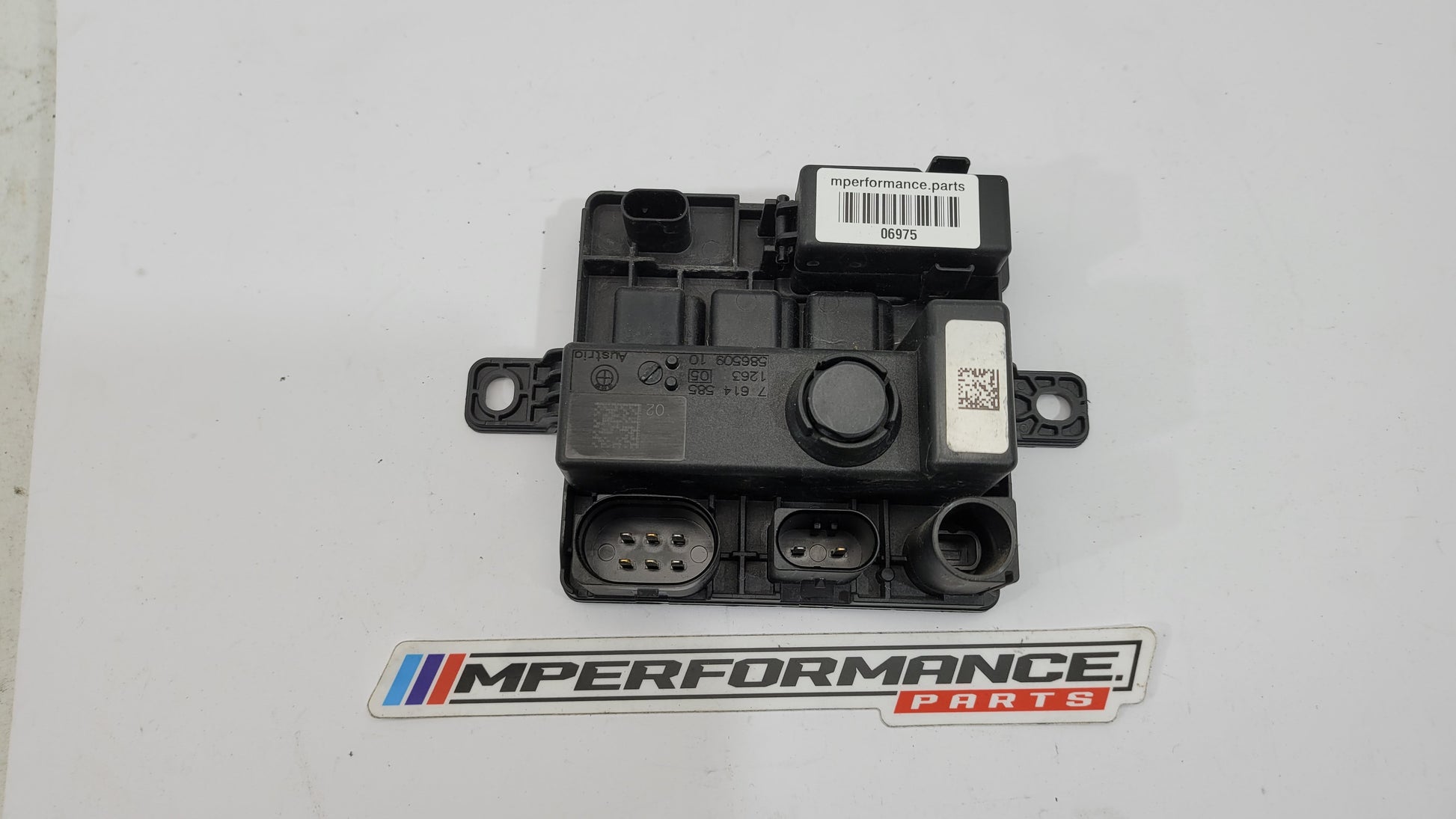 BMW F8x M3 M4 integrated supply module by MPerformance.parts, showing the black plastic component with mounting points.
