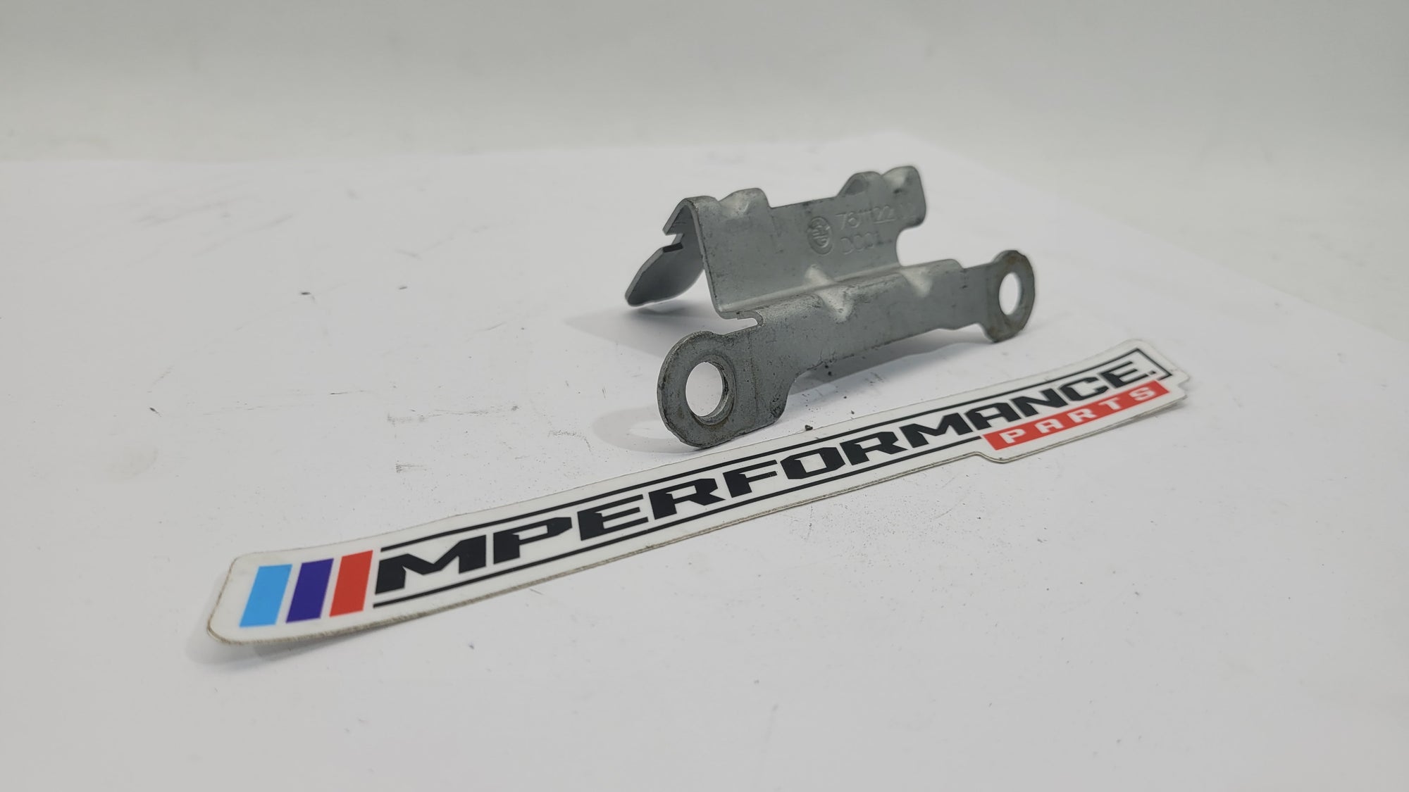BMW M2 main body engine wire harness cable holder bracket by MPerformance.parts, shown mounted on the engine.
