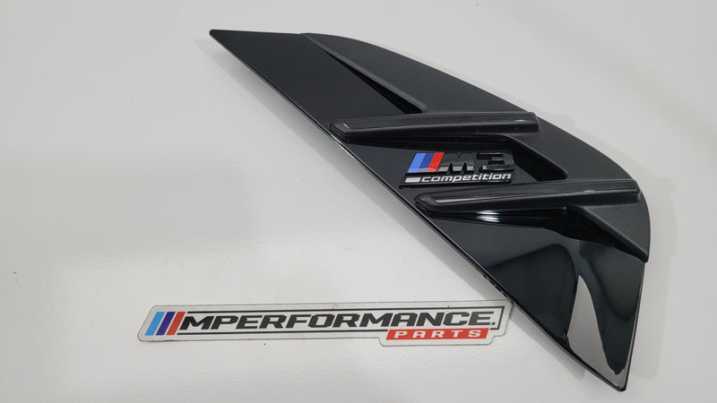BMW M3 Competition G80 right exterior trim grille in black, showing the detailed grille design and mounting points.