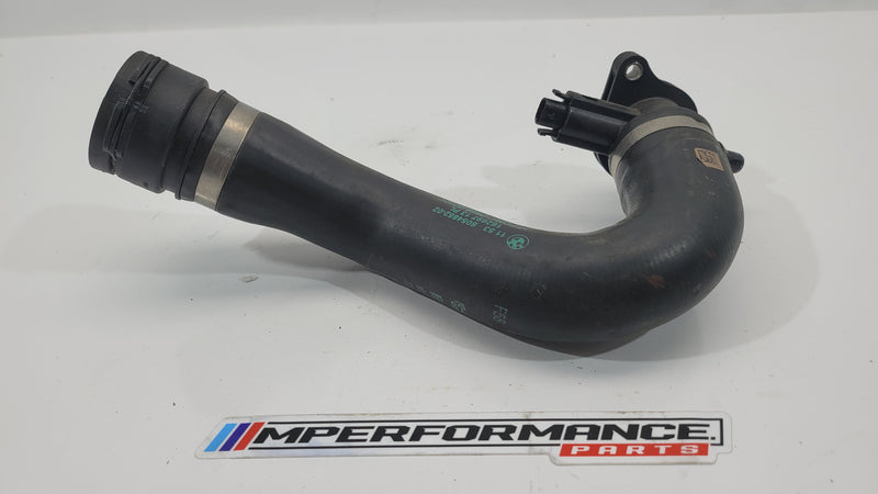 BMW M3 G80 water pump coolant tube in black, with metal and rubber fittings, designed for engine cooling system replacement.