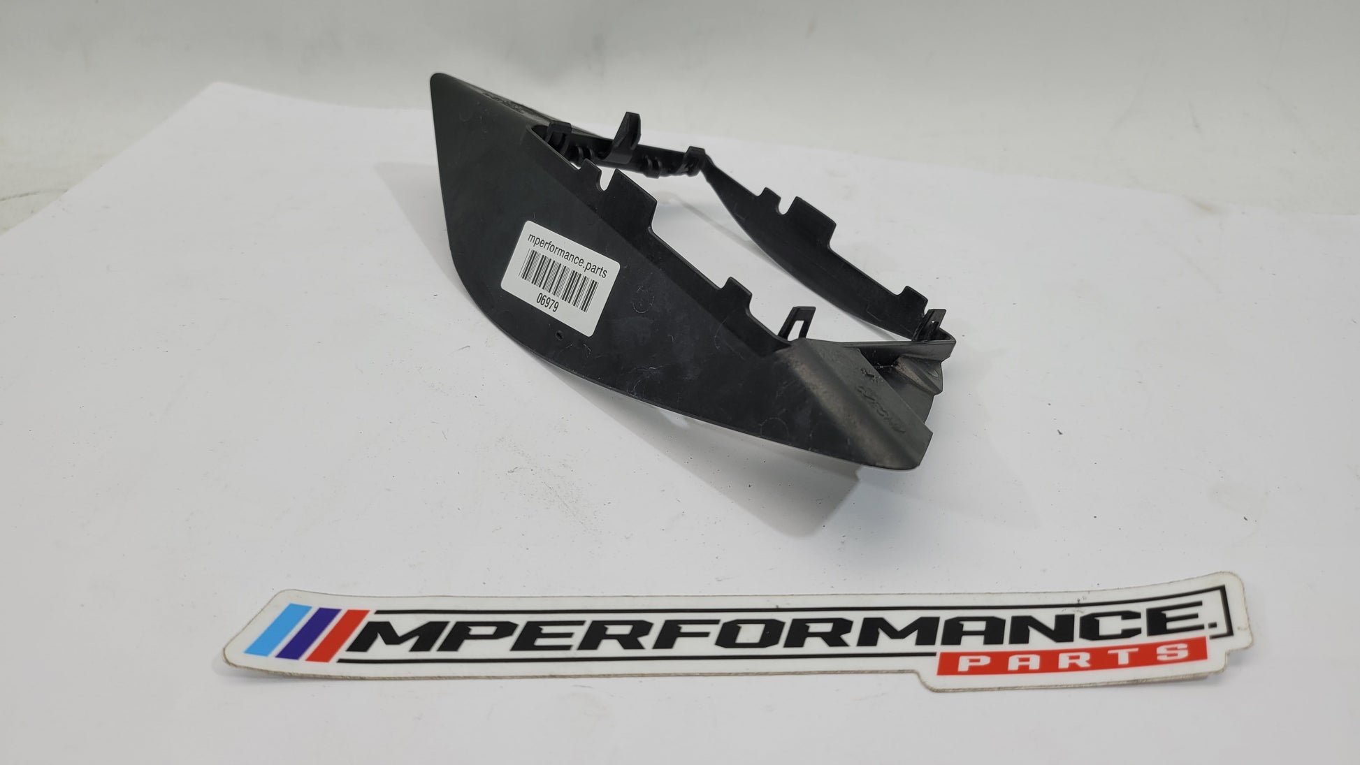 BMW G80 M3 Competition blind spot sensor bracket by MPerformance.parts, showing the metal bracket with mounting details.