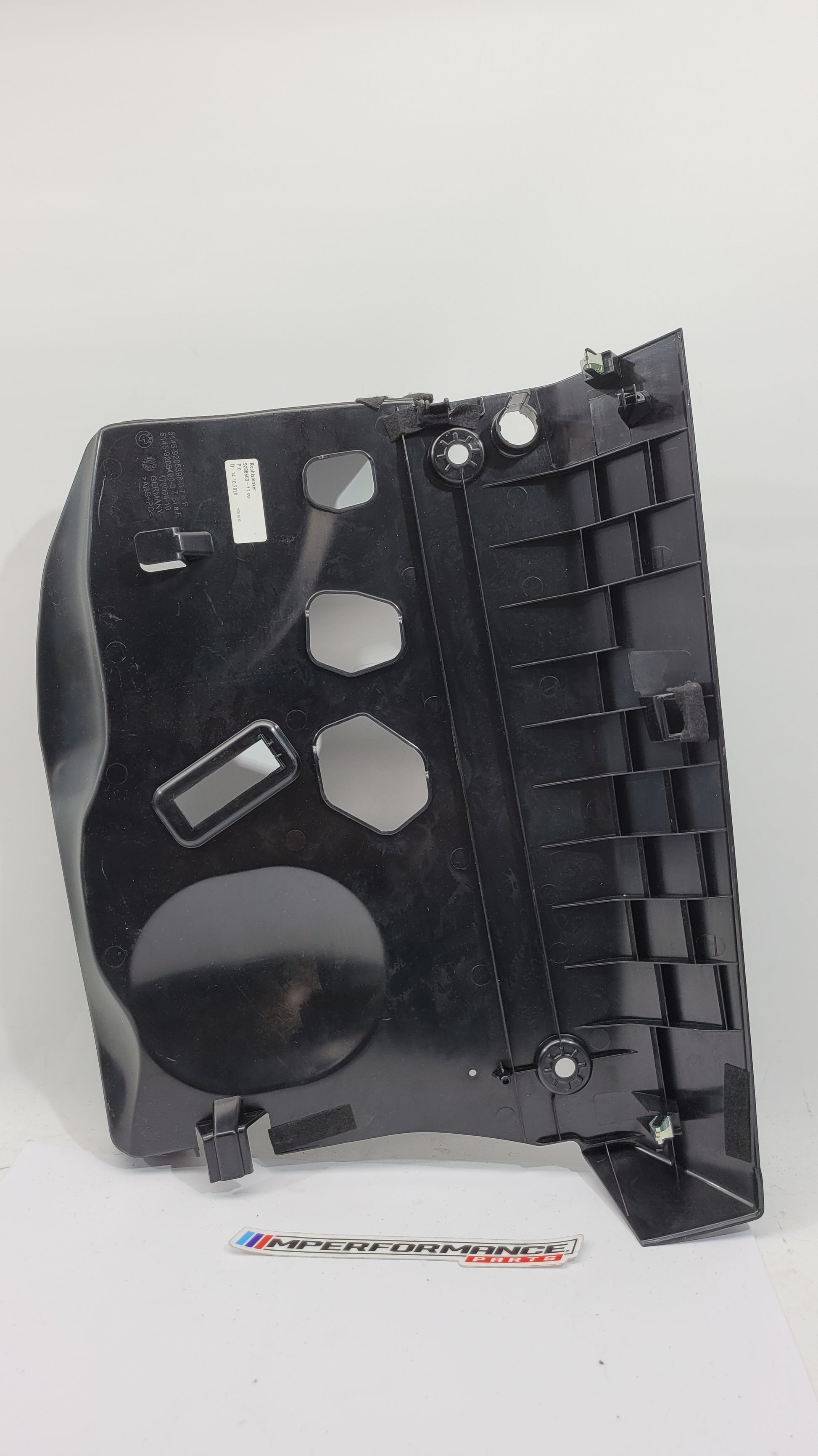 BMW 1 Series F20 F21 F23 front left lower dash cover panel trim in black with MPerformance.parts branding.
