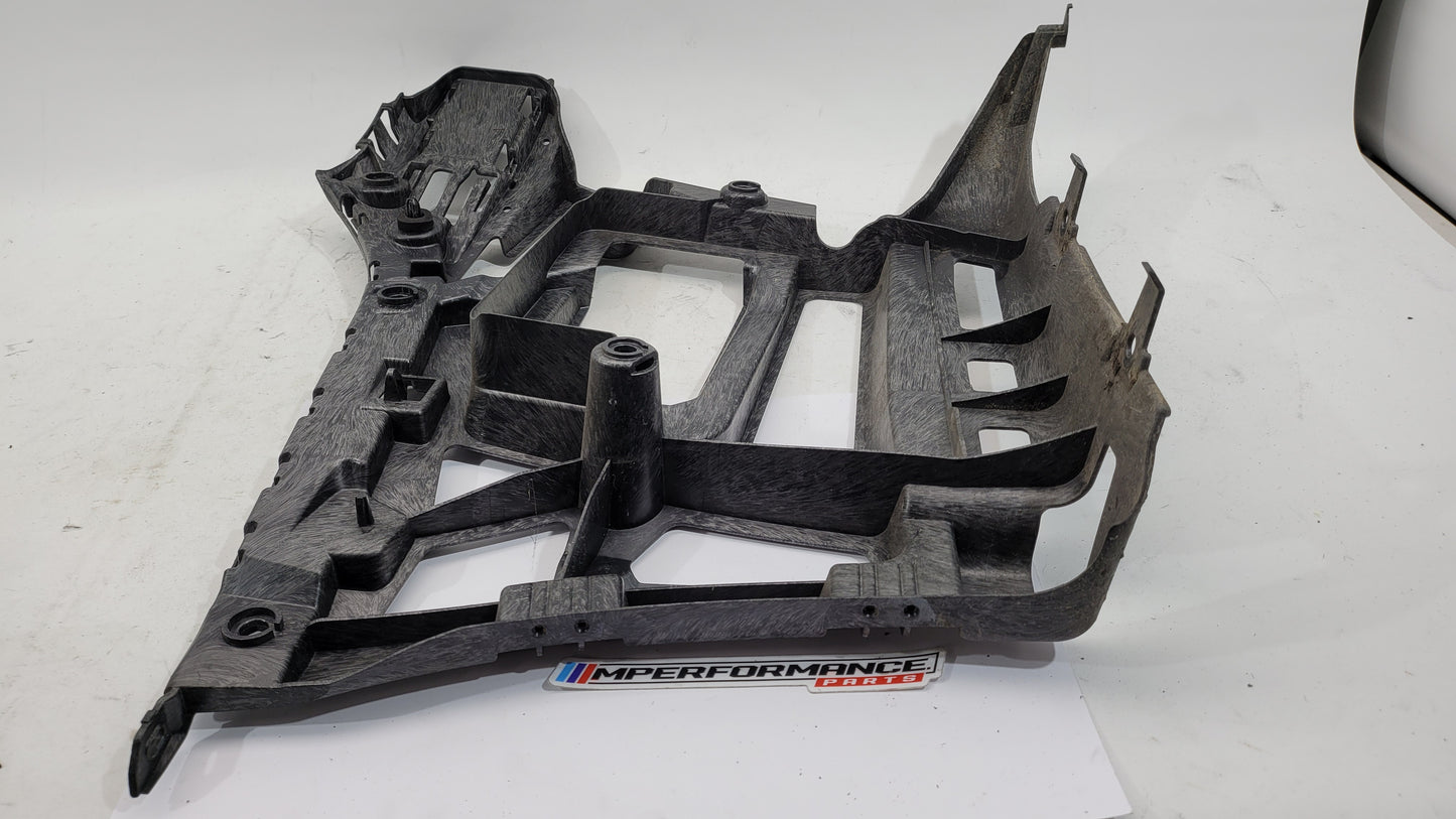 BMW M3 xDrive G80 rear bumper support bracket showing a metal mounting component with bolt holes.