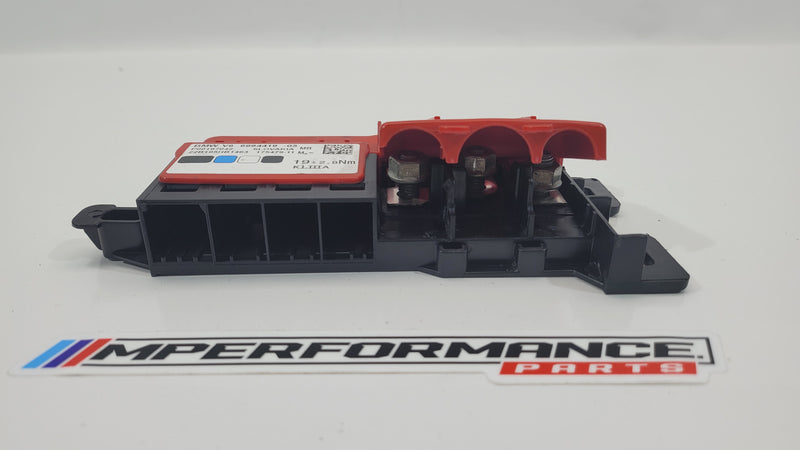 BMW G20 G80 M3 battery terminal power distribution fuse box with MPerformance.parts branding, showing the fuse box and terminal connections.