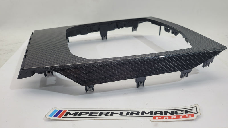 BMW M3 G80 interior carbon trim by MPerformance.parts, showing sleek black carbon fiber accents inside the vehicle.