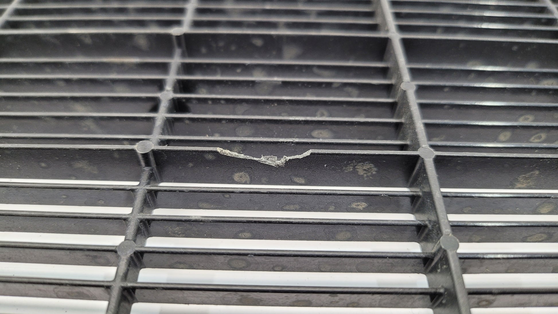 BMW G80 G82 G83 M3 M4 Competition plastic radiator cover shroud in black with MPerformance.parts branding, showing detailed close-up.