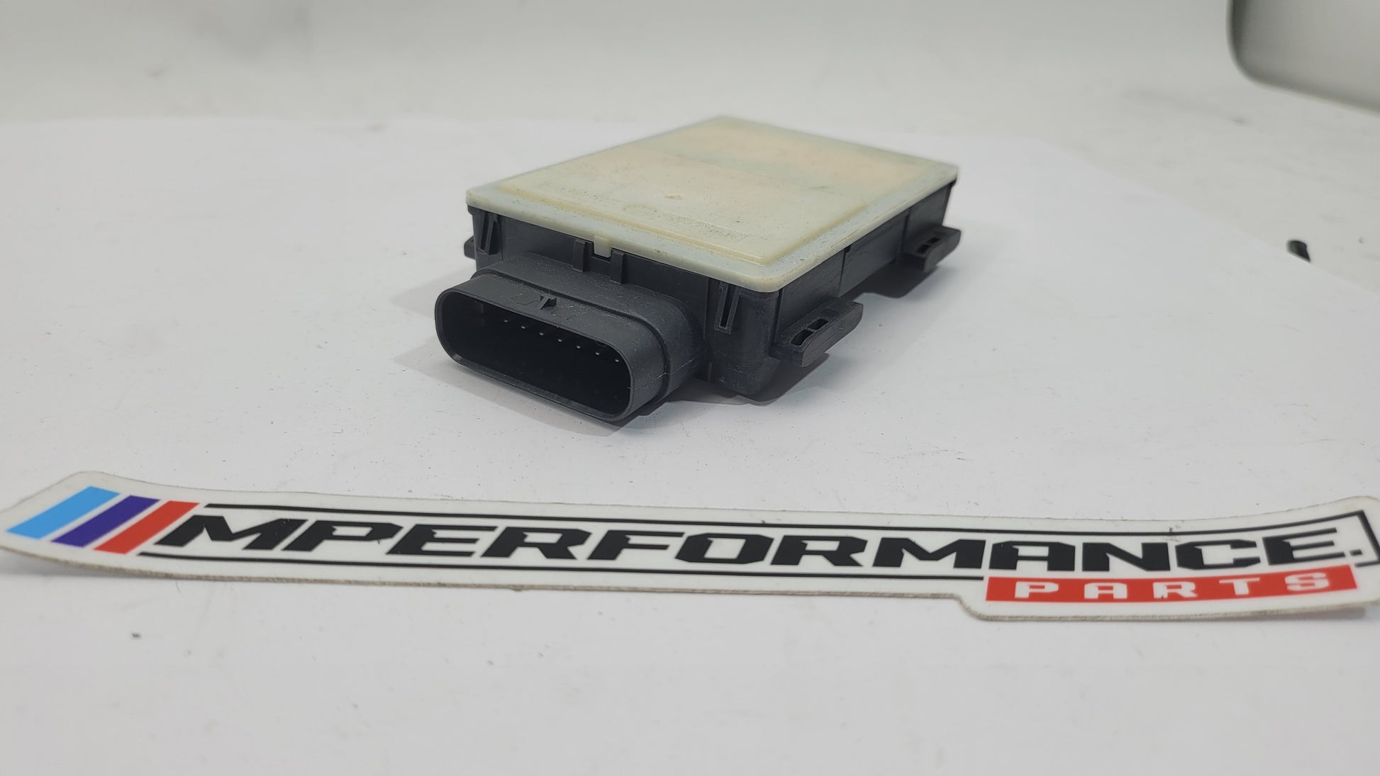 BMW G05 X5 X4 X3 G30 G20 G80 M3 front spot radar sensor by MPerformance.parts, showing the sensor component for vehicle safety.