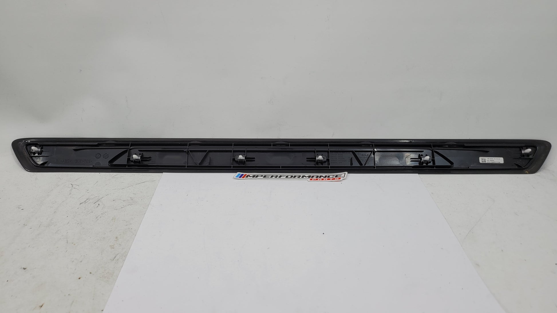 BMW M2 Competition F87 door sill scuff plate, left or right, MPerformance.parts, close-up showing textured surface and branding.