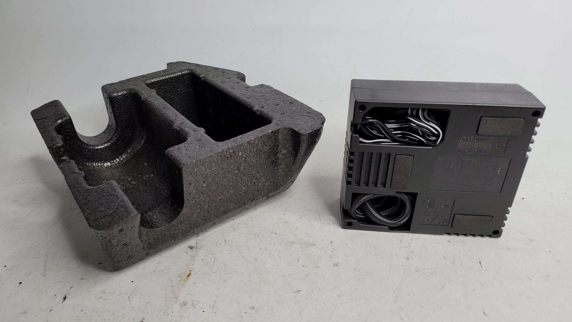 BMW 3 4 F30 F32 F82 F80 M3 M4 spare tire air compressor storage tray by MPerformance.parts, shown in black with mounting details.