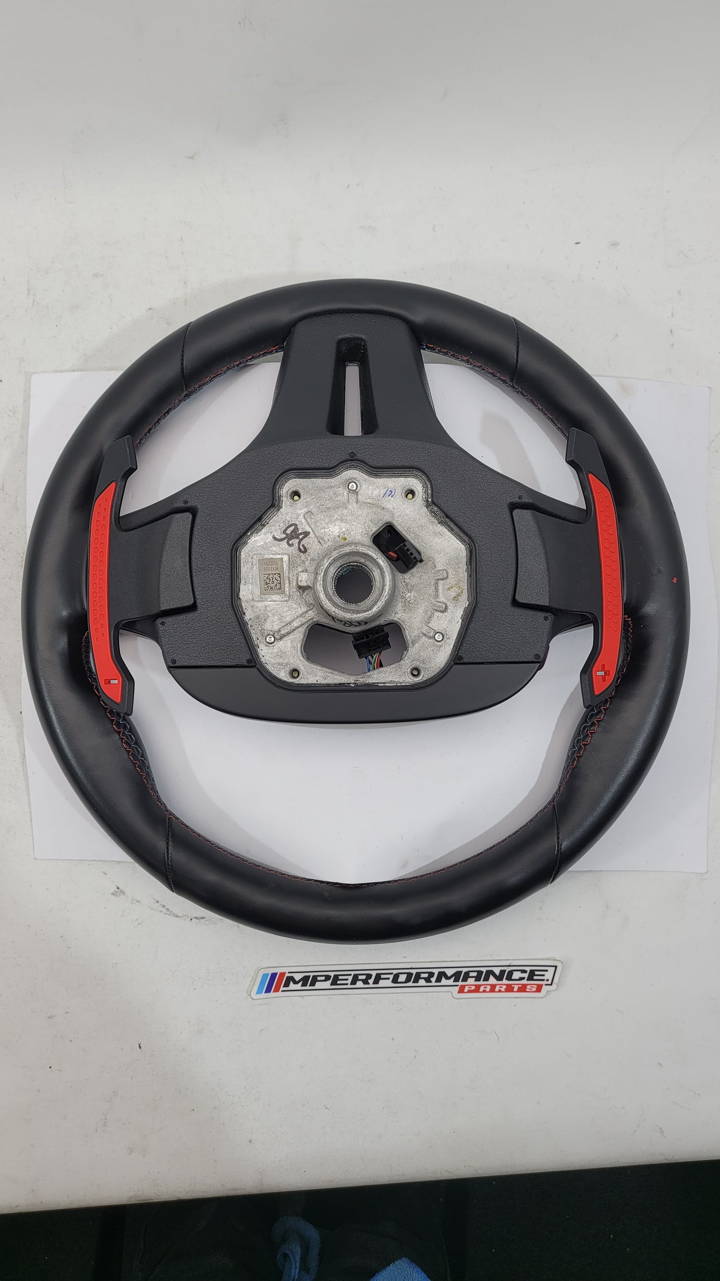 BMW M2 M3 M4 G80 G82 leather M steering wheel with MPerformance.parts branding, featuring sporty grip and detailed stitching.