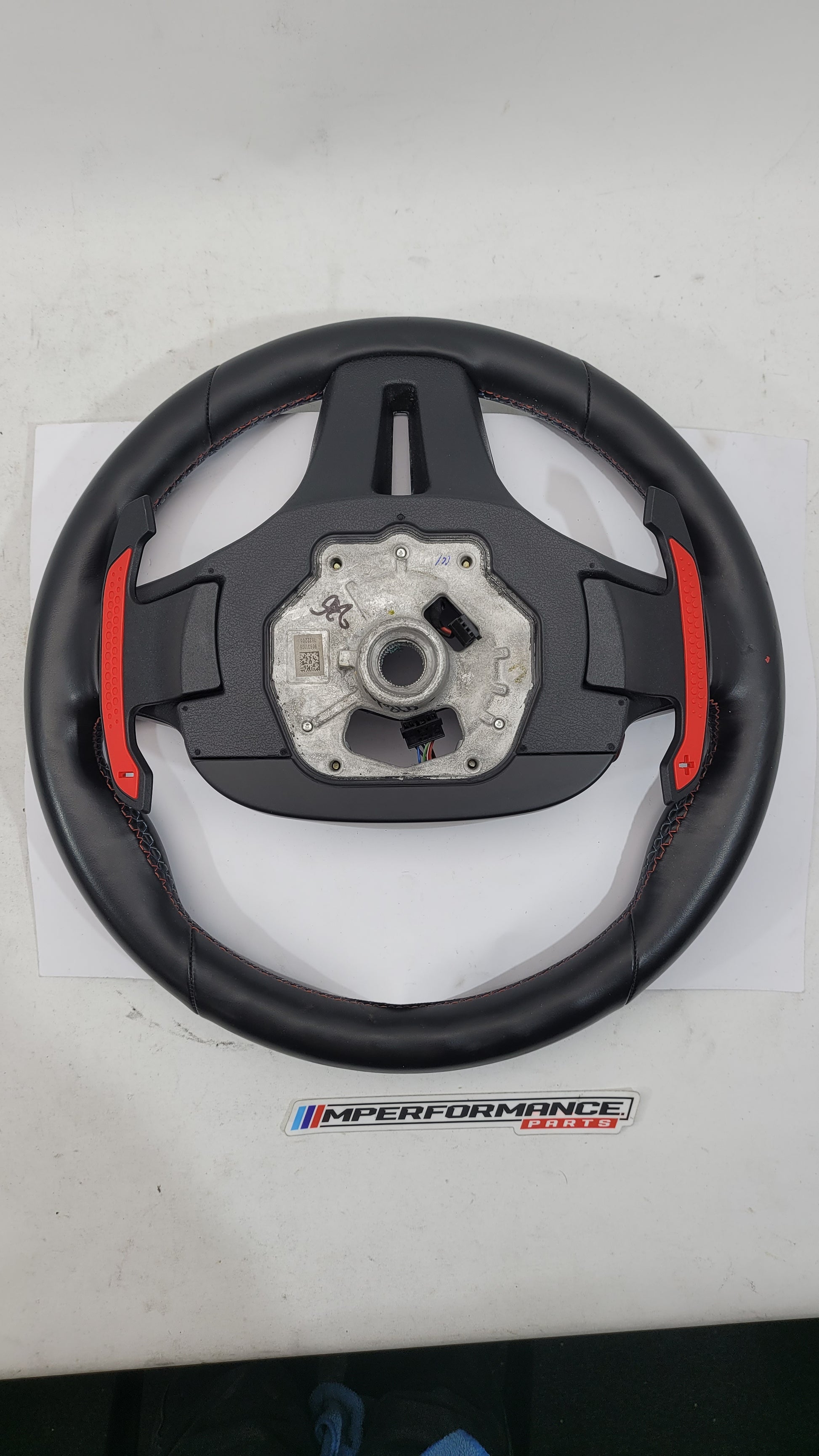 BMW M2 M3 M4 G80 G82 leather M steering wheel with MPerformance.parts branding, featuring sporty grip and detailed stitching.