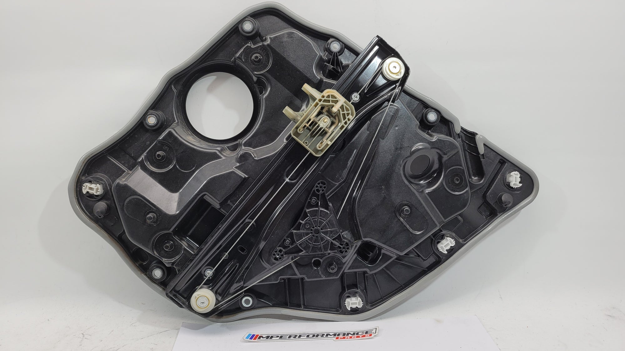 BMW M3 Series G20/G8x rear left window regulator and motor, part 7432235, installed in the vehicle's window assembly.