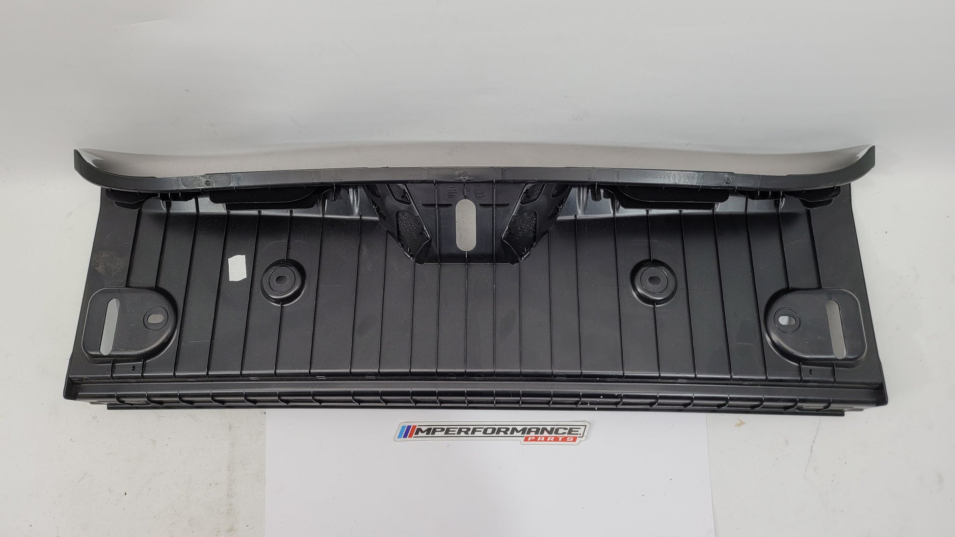BMW 2 Series F22 F87 coupe trunk lock trim in black with silver accents, part number 7296038, from MPerformance.parts.