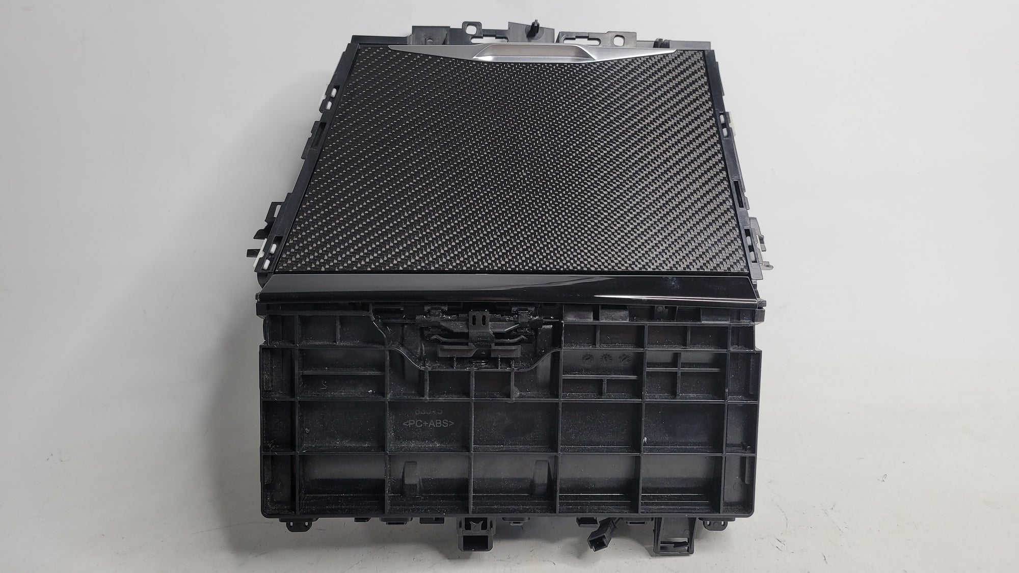 BMW 3 Series G80 G21 and 4 Series G22 G23 M3 front center console storage compartment with WCA/NFC features, black finish.