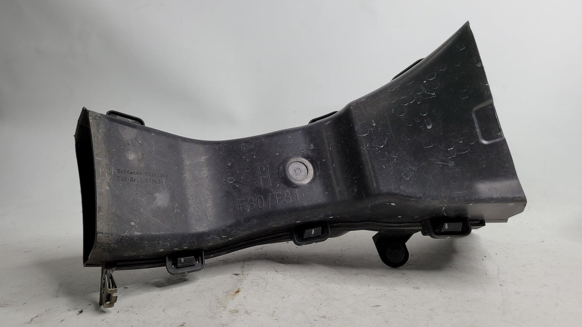 BMW 328i F30 front right passenger brake air duct, OEM replacement part from MPerformance.parts, shows the duct's design and mounting points.