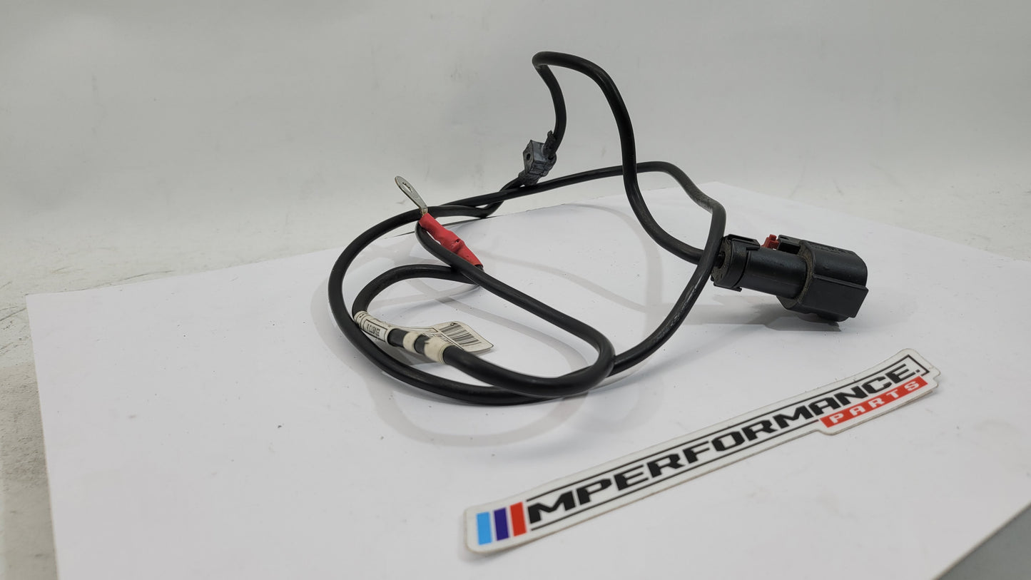 BMW F83 M4 positive battery power distribution cable from MPerformance.parts, showing the heavy-duty cable with connectors and insulation.