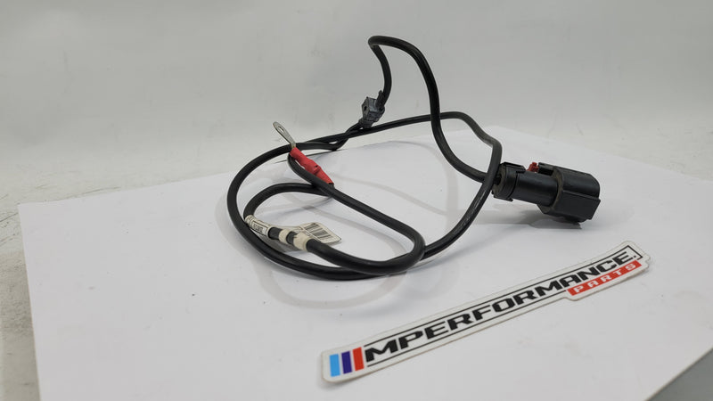 BMW F83 M4 positive battery power distribution cable from MPerformance.parts, showing the heavy-duty cable with connectors and insulation.